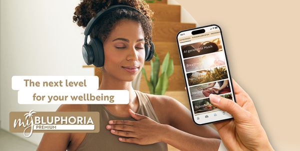 MyBLUPHORIA Premium Image shows relaxed woman and smartphone, caption: ‘The next level for your wellbeing MyBLUPHORIA Premium’